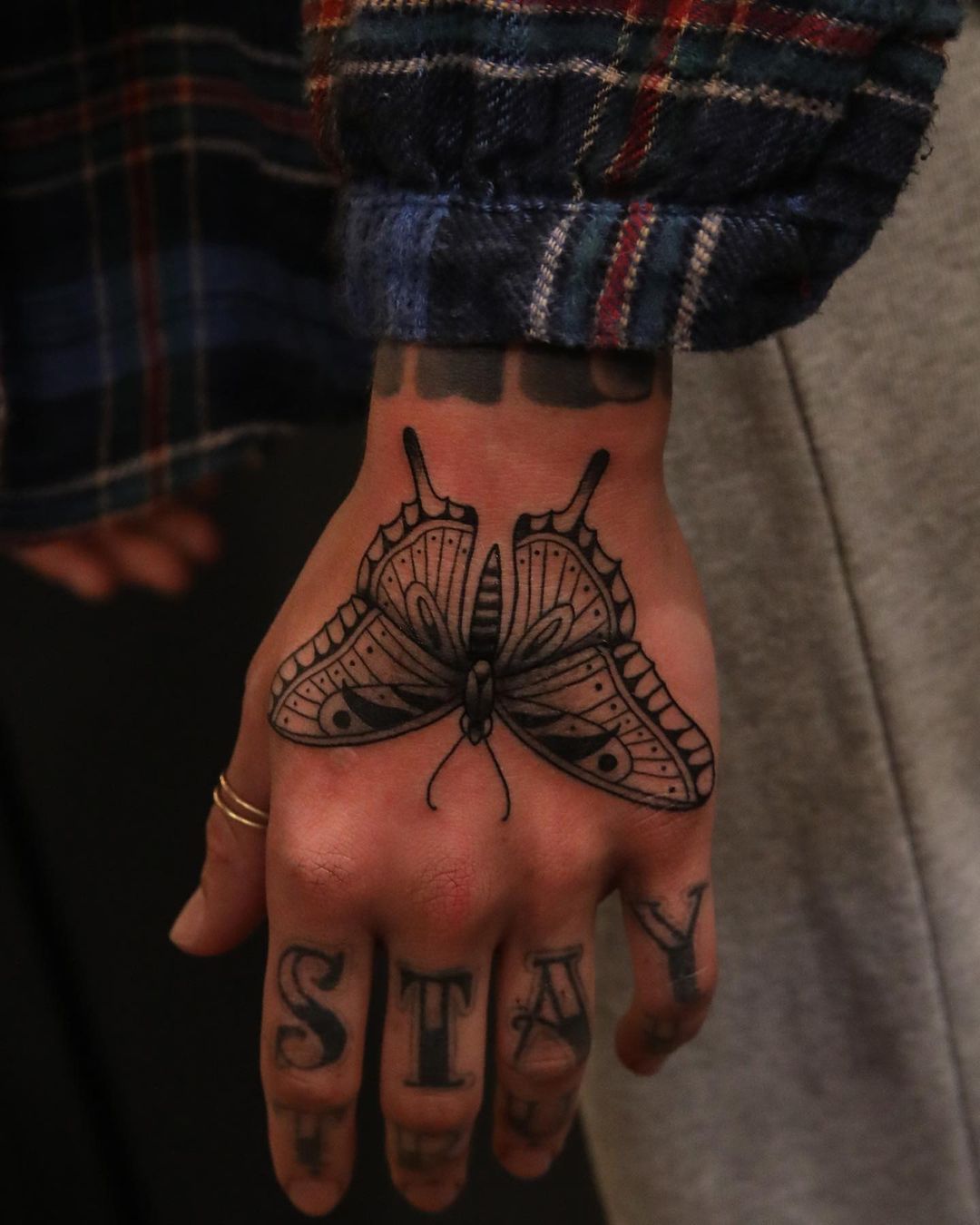 small butterfly hand tattoo 0018