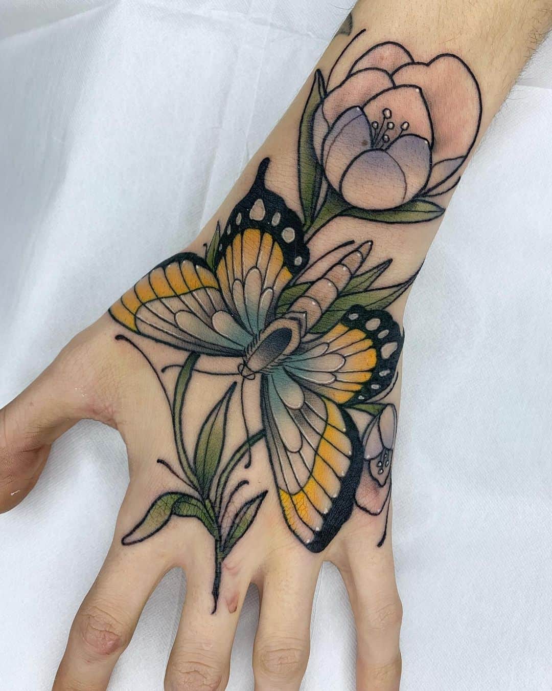 small butterfly hand tattoo 0030