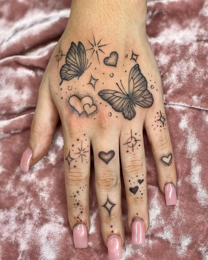 small butterfly hand tattoo 0059