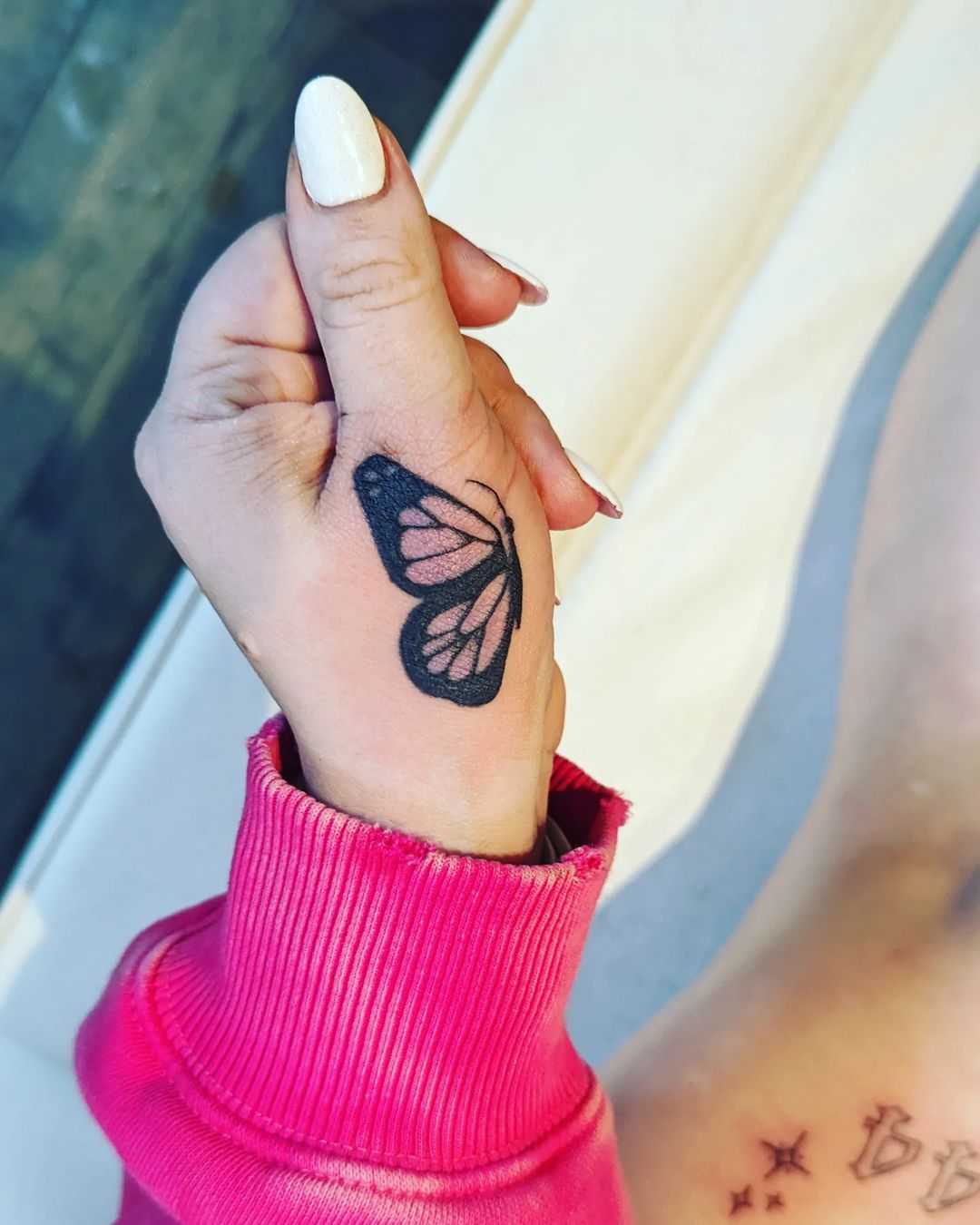 small butterfly hand tattoo 0066