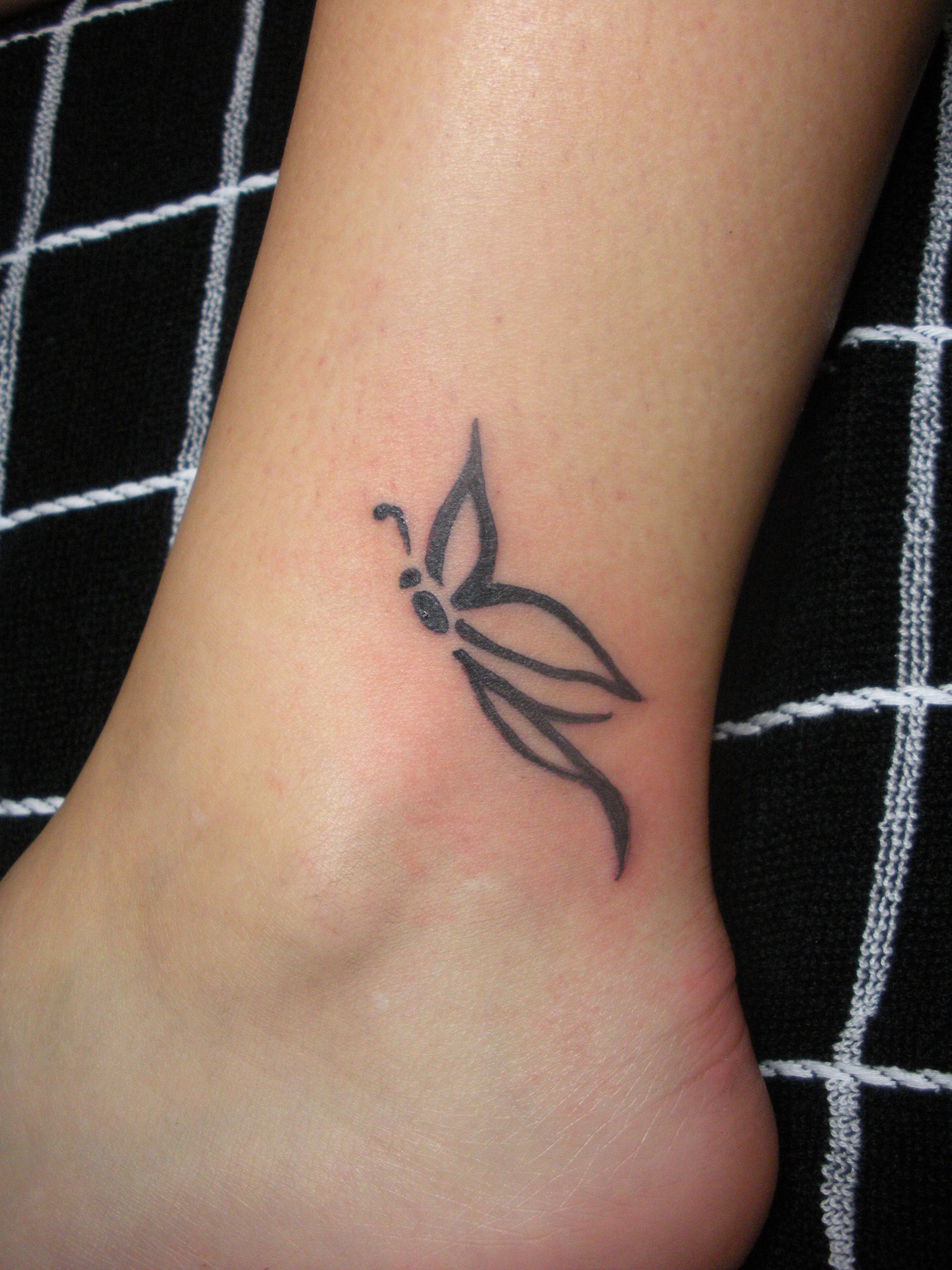 small butterfly hand tattoo 0067