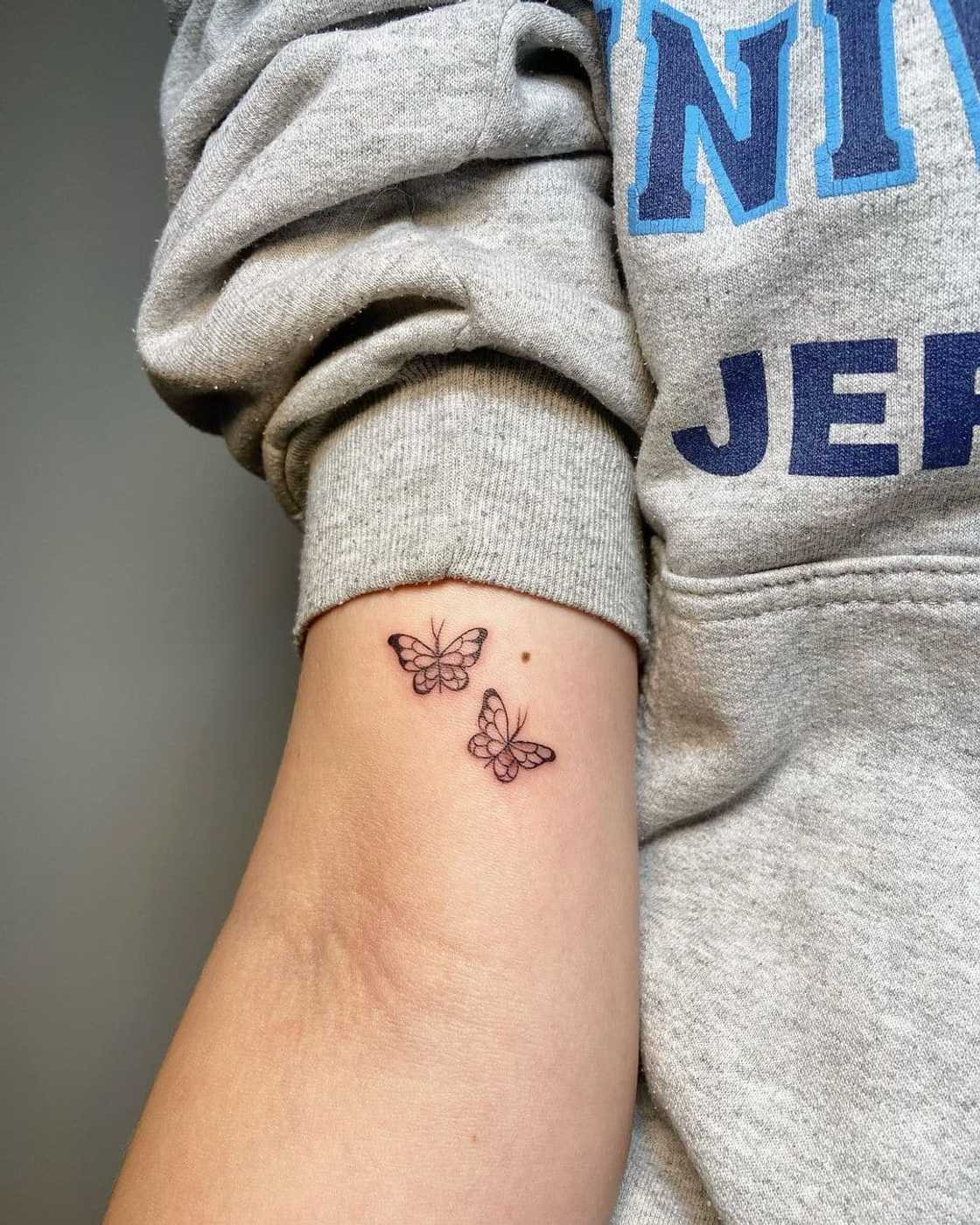 small butterfly hand tattoo 0080