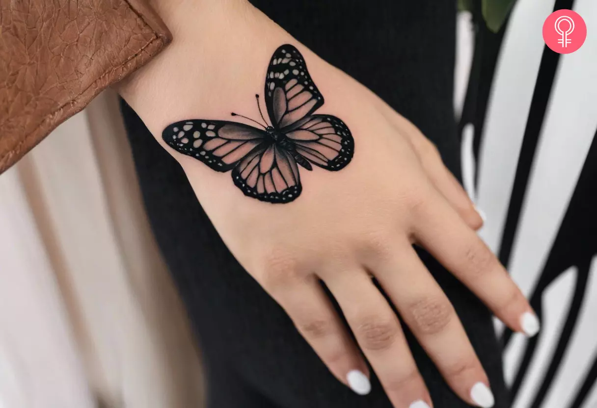 small butterfly hand tattoo 0083