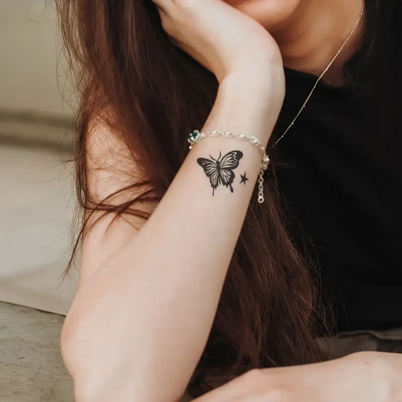 small butterfly hand tattoo 0088