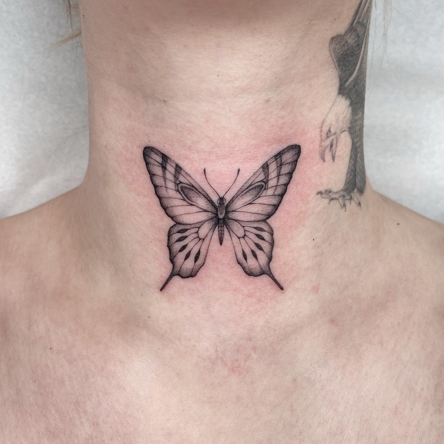 small butterfly neck tattoo 0013