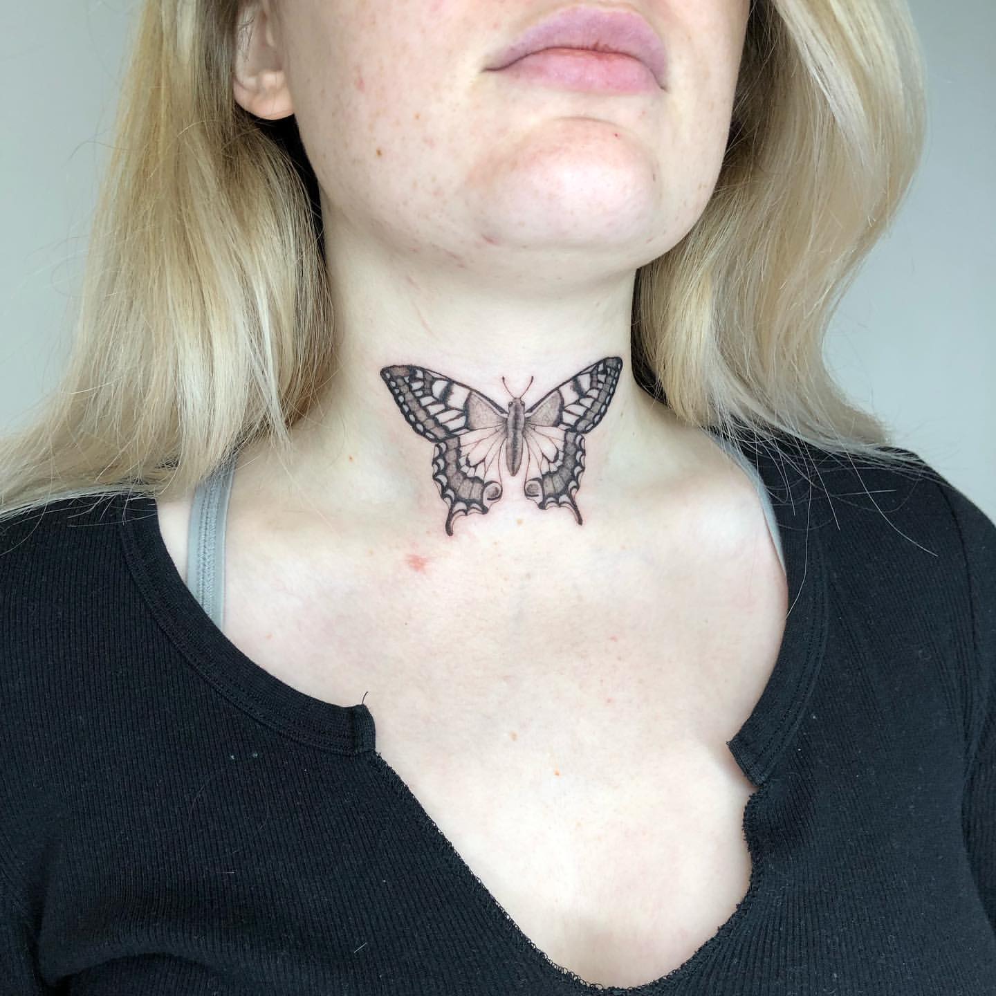 small butterfly neck tattoo 0018