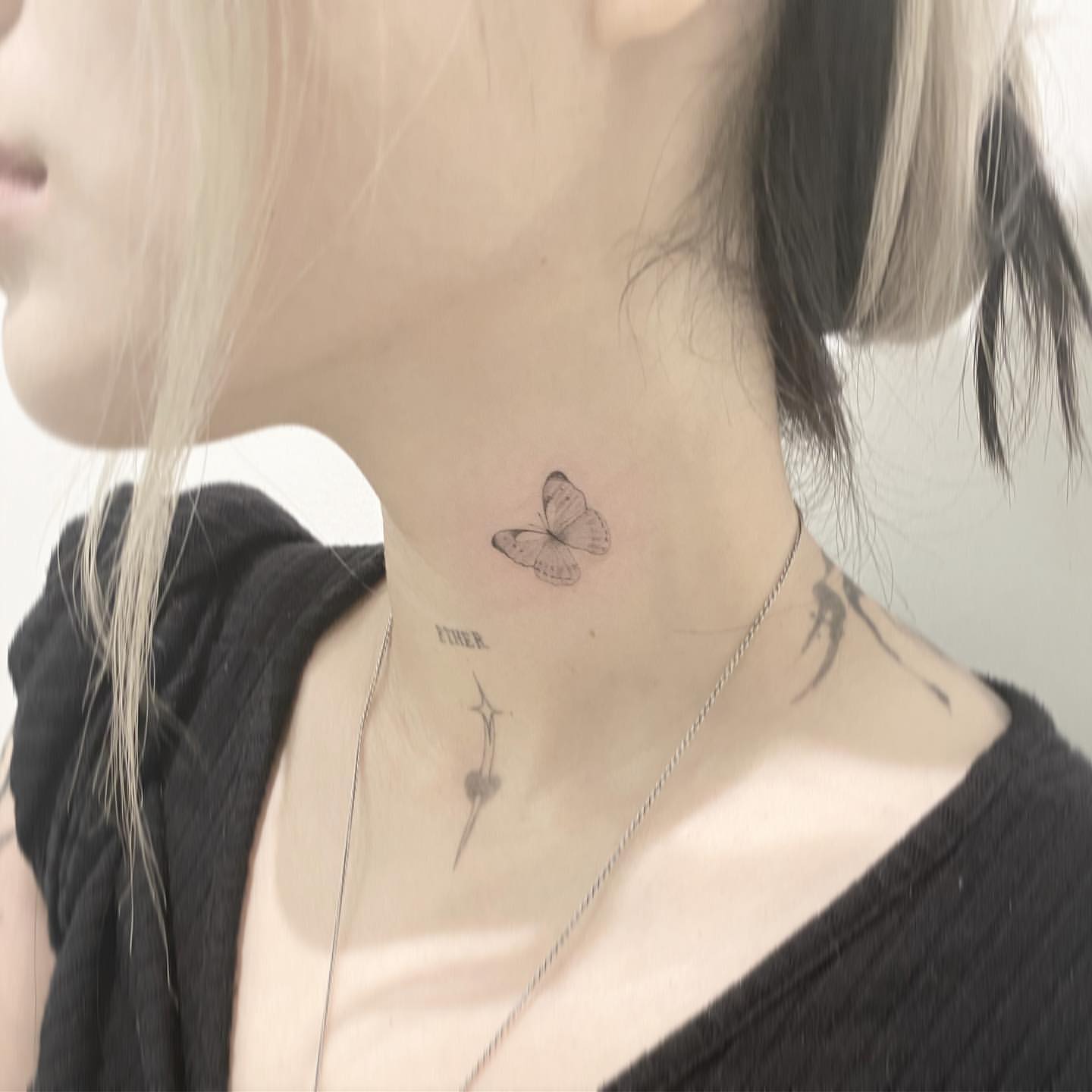 small butterfly neck tattoo 0022