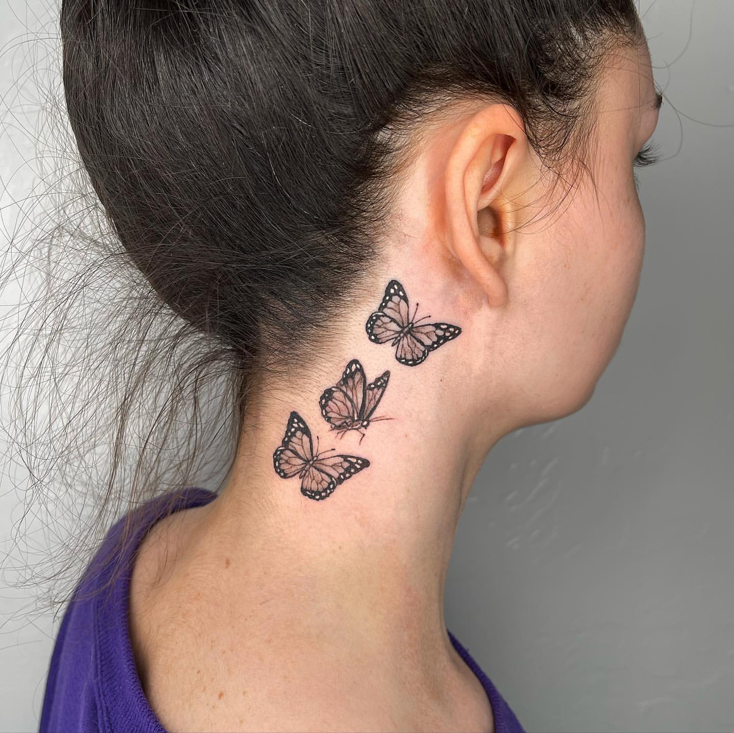 small butterfly neck tattoo 0070