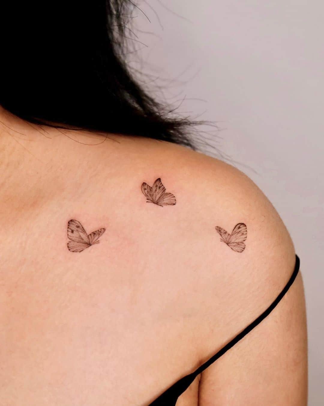 small butterfly neck tattoo 0072