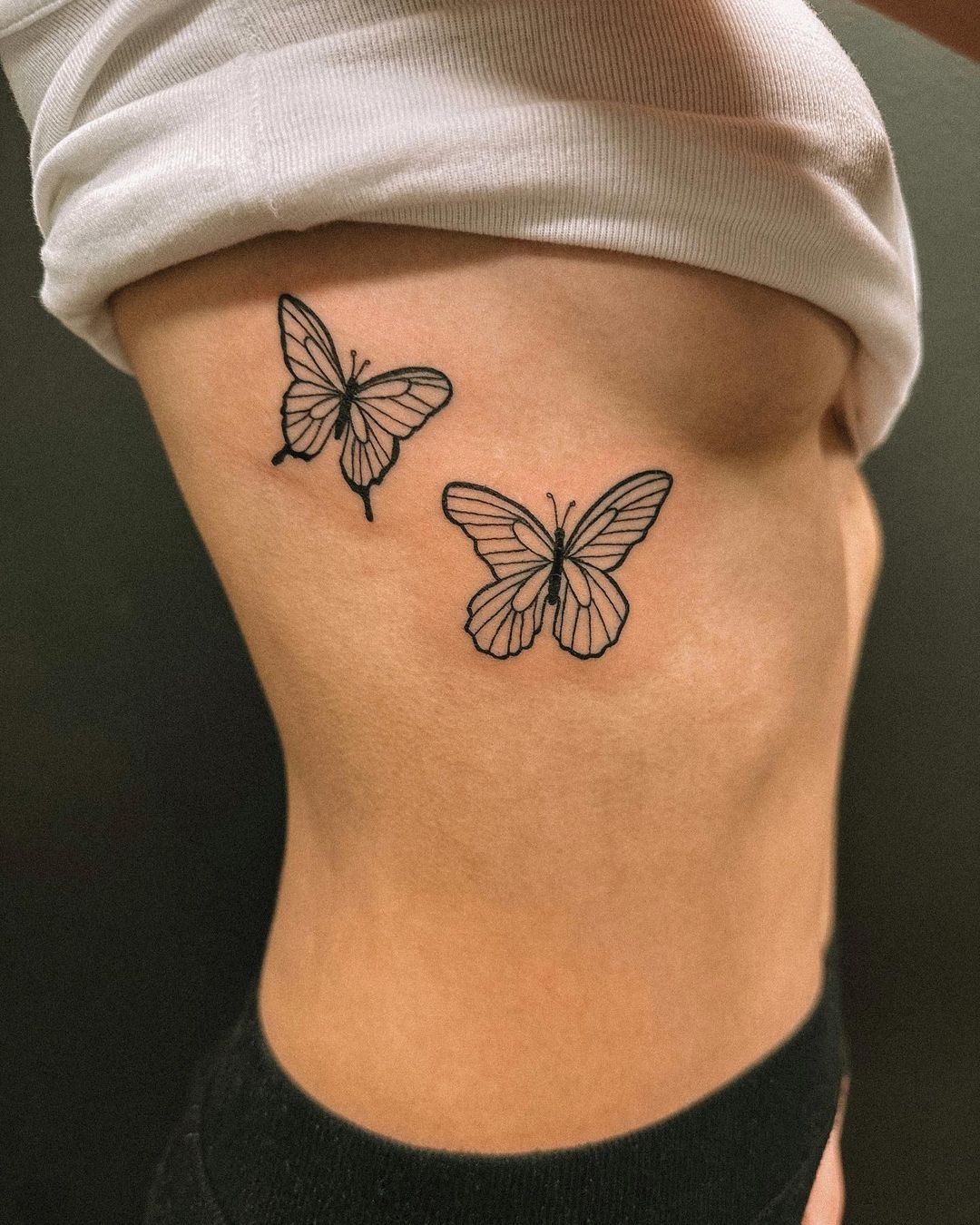 small butterfly neck tattoo 0074