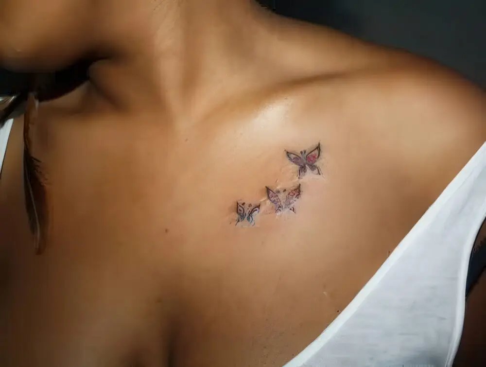 small butterfly neck tattoo 0096