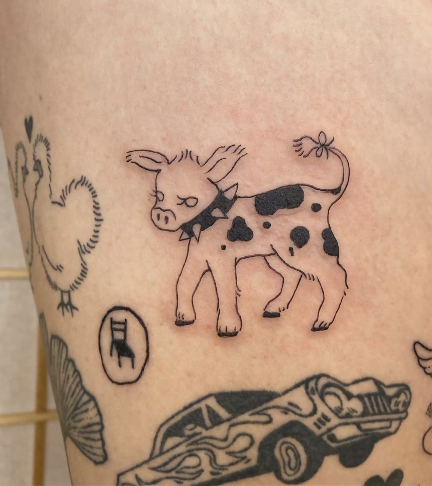 small cow tattoo 0059