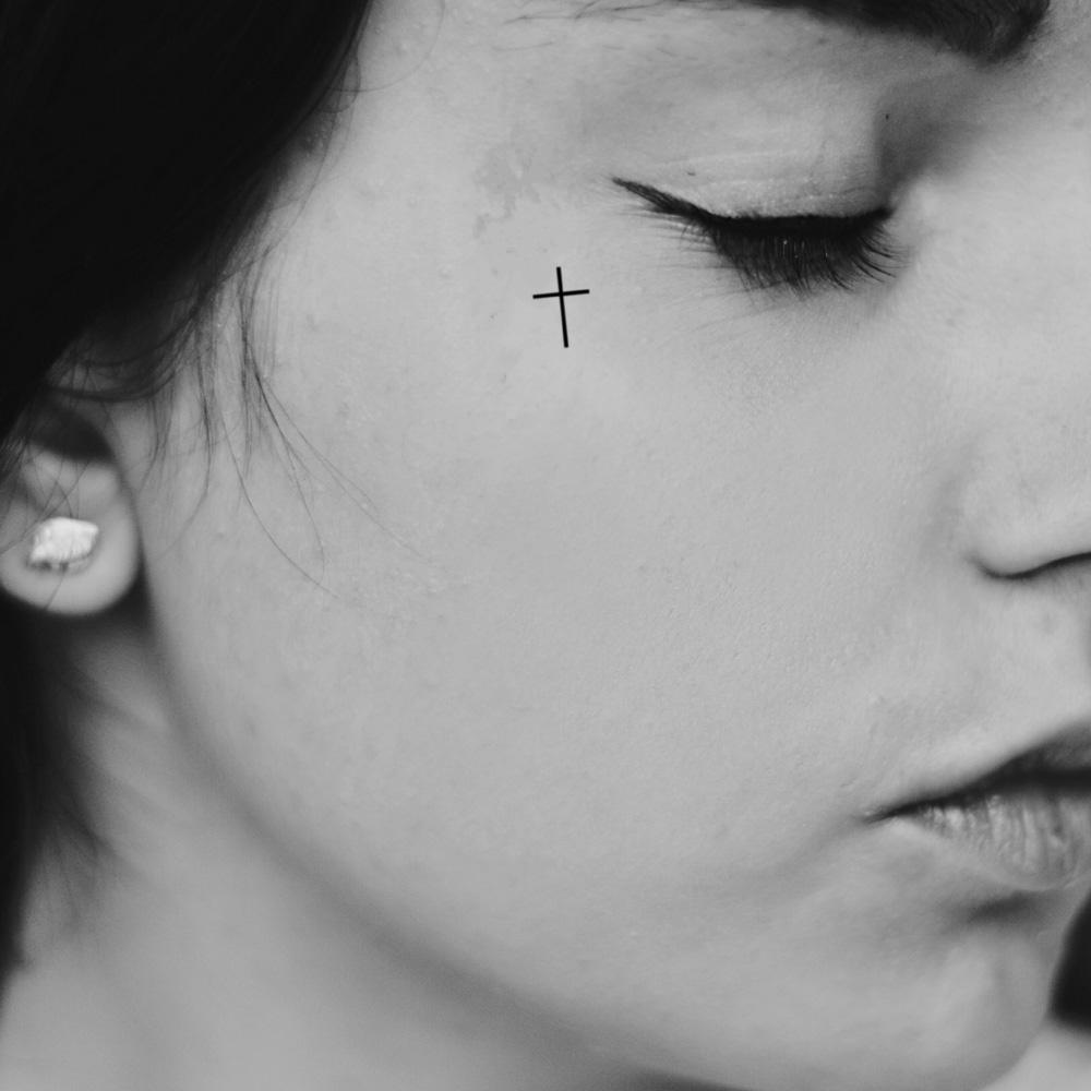 small cross face tattoo ideas