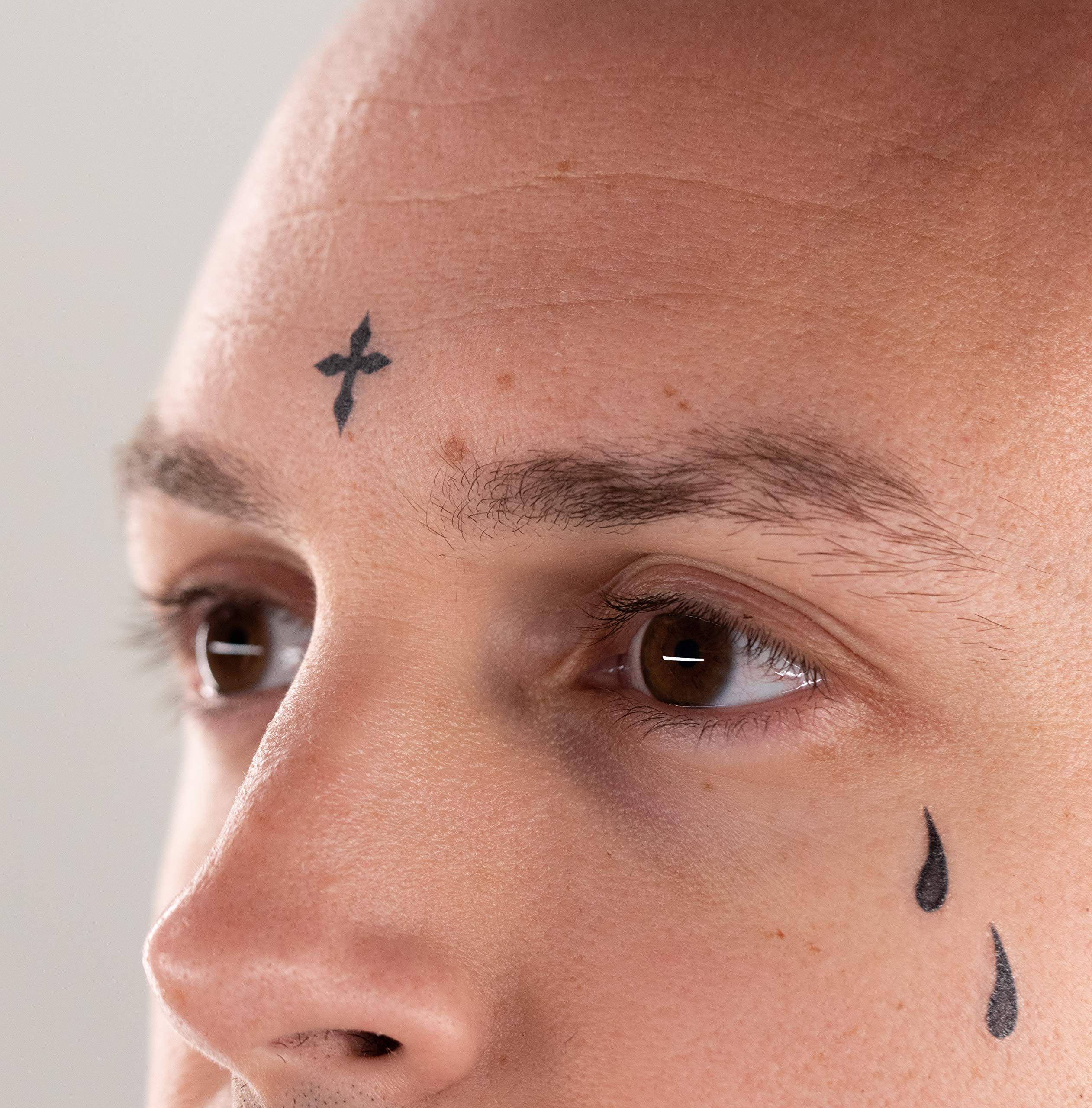 small cross face tattoo 0027