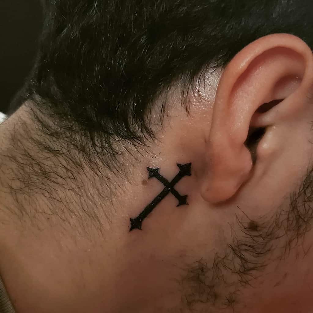 small cross face tattoo 0030