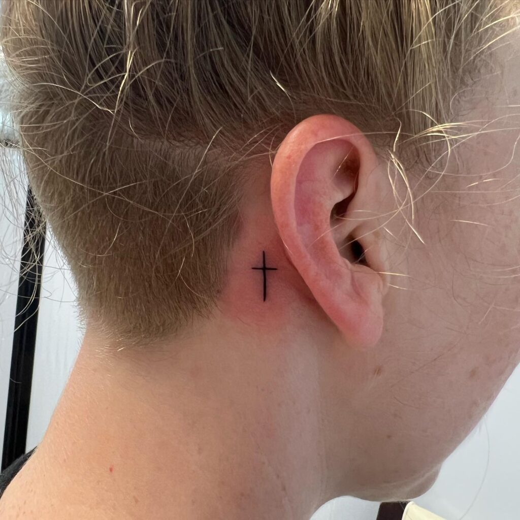 small cross face tattoo 0047