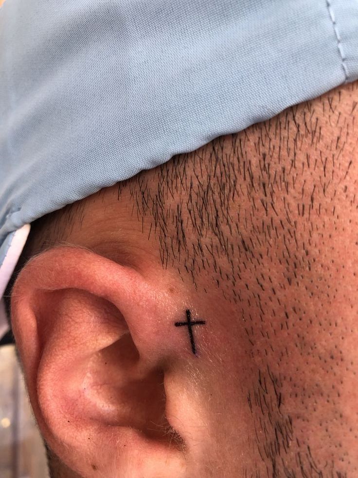 small cross face tattoo 0061