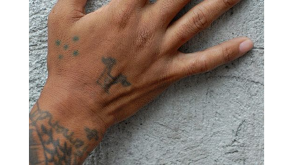 small cross face tattoo 0066