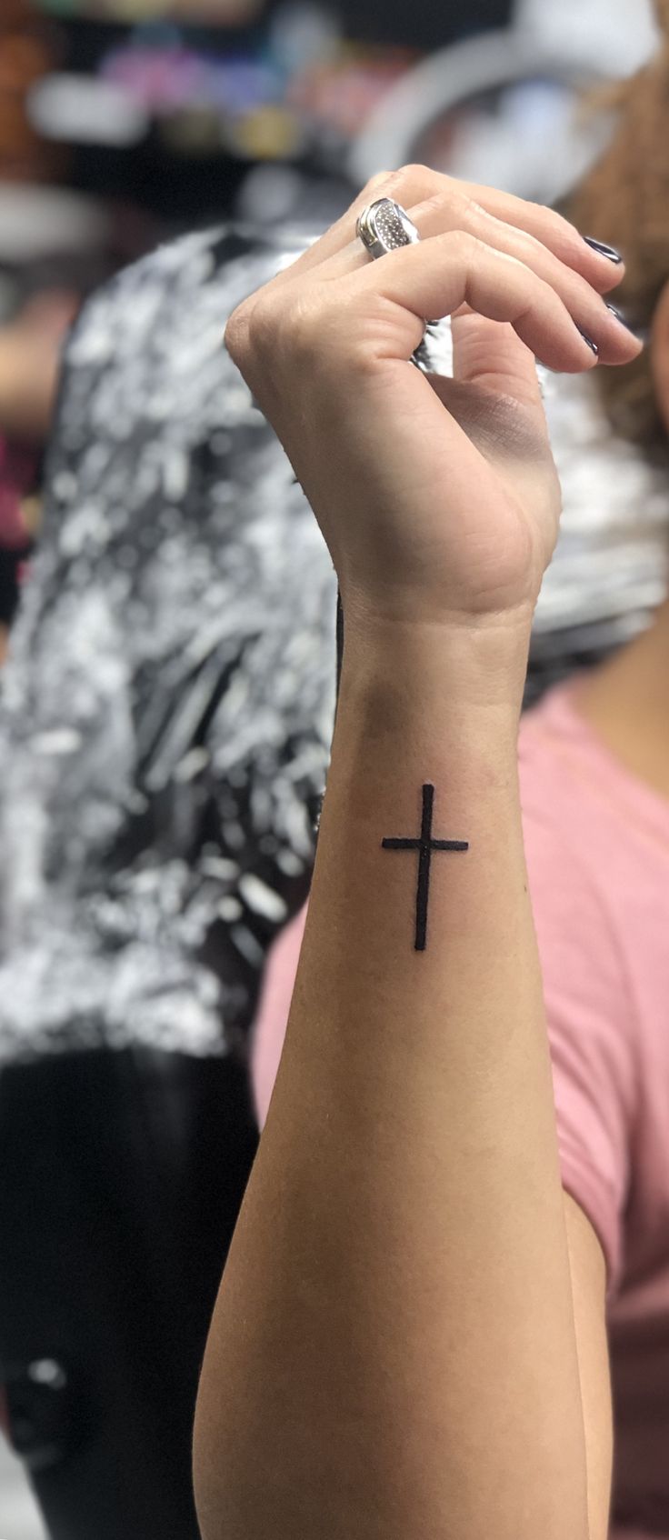 Small cross tattoo