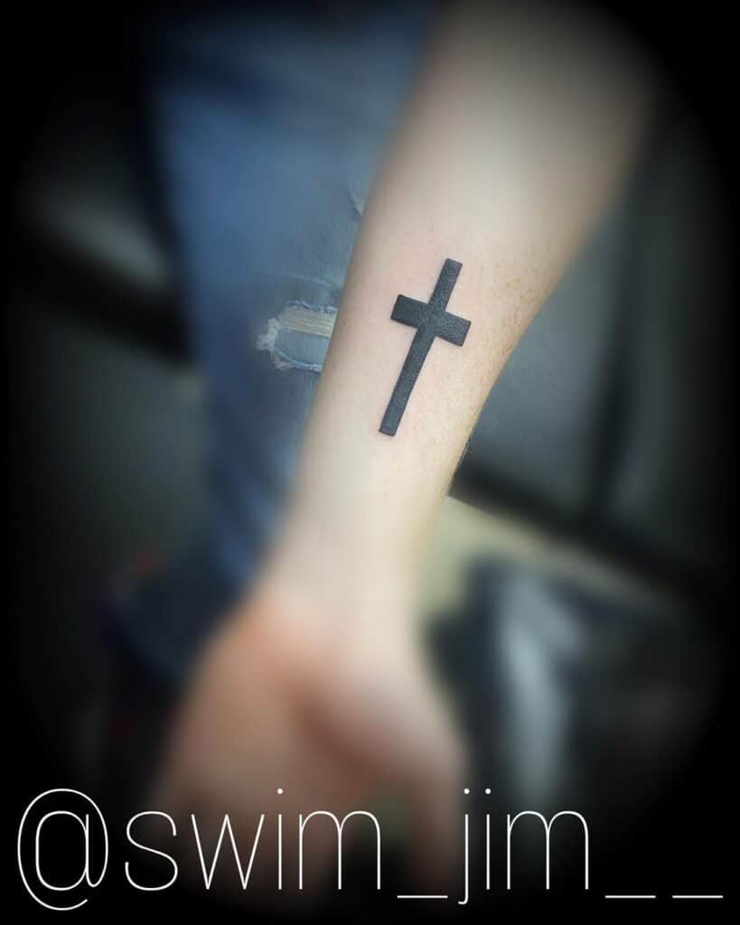 Small cross tattoo 0056