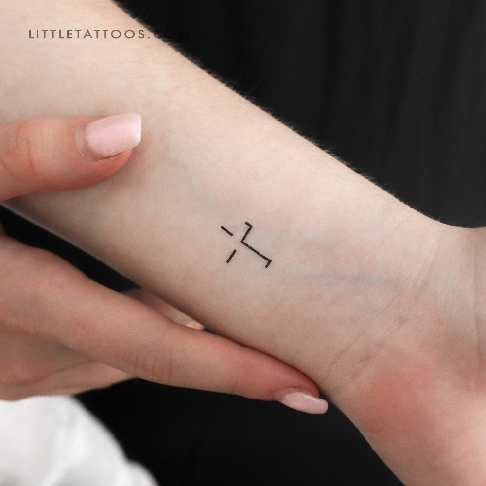 Small cross tattoo 0064