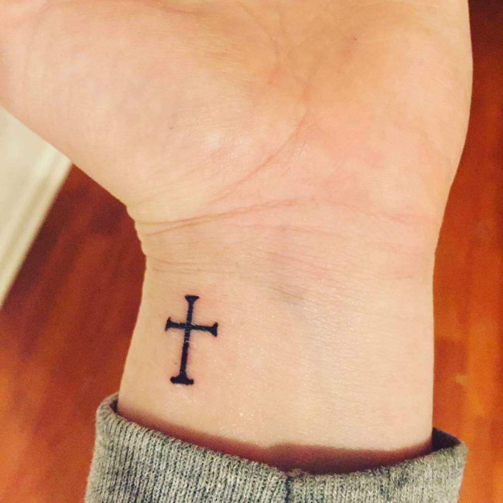 Small cross tattoo