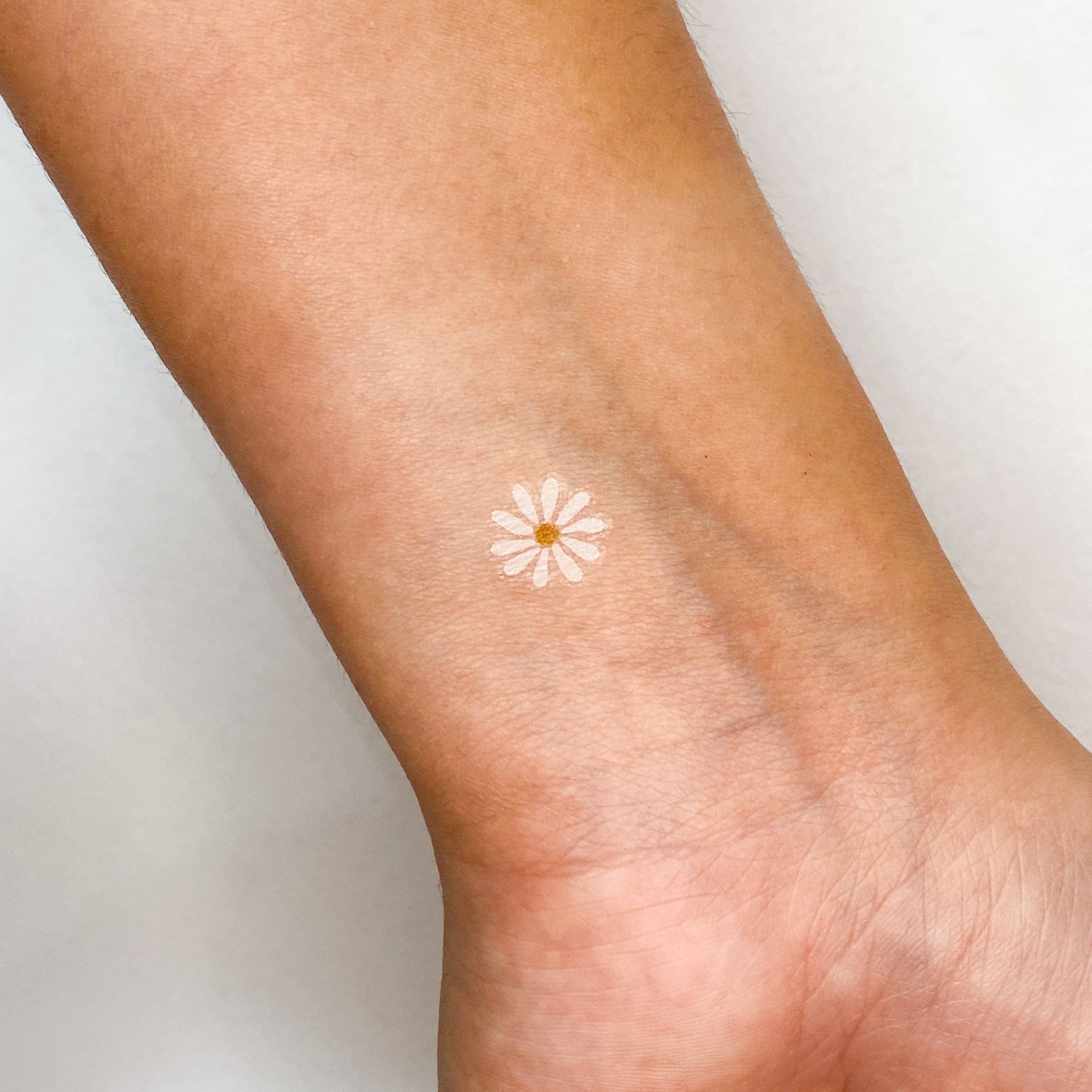 small daisy tattoo placements