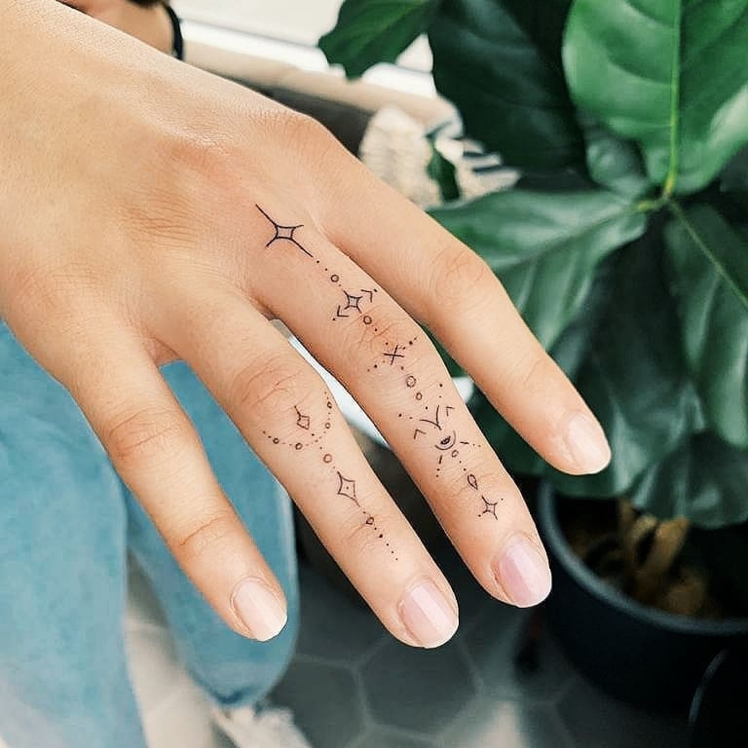 small finger tattoo