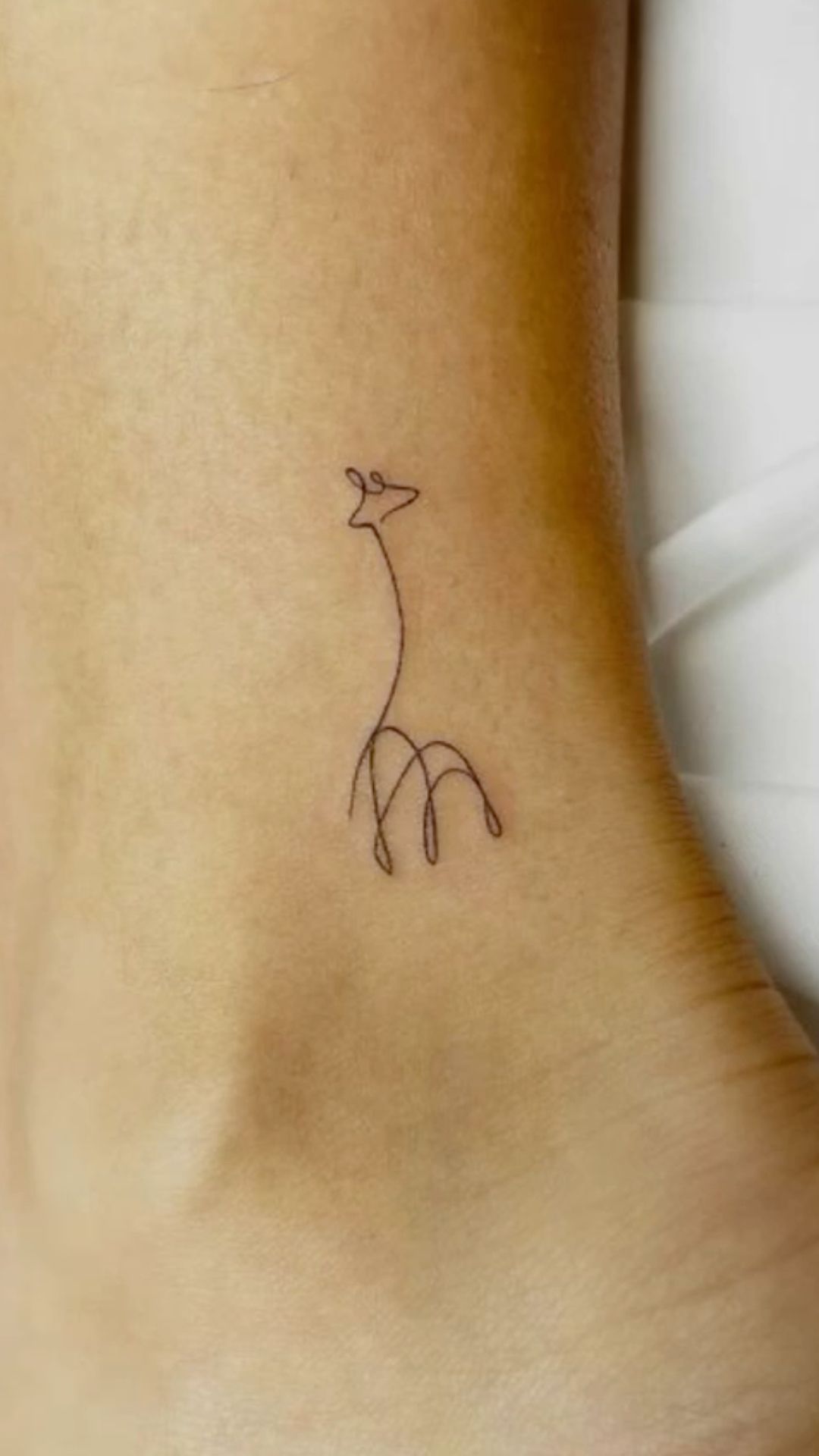 small giraffe tattoo 0027