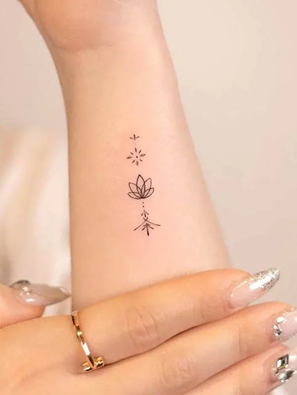 small lotus flower tattoo symbolism and meaning