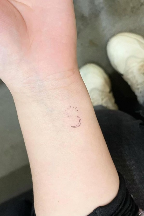 Small sun tattoo 0050