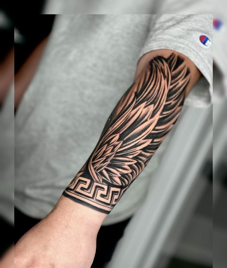 small wing tattoo on forearm 0011