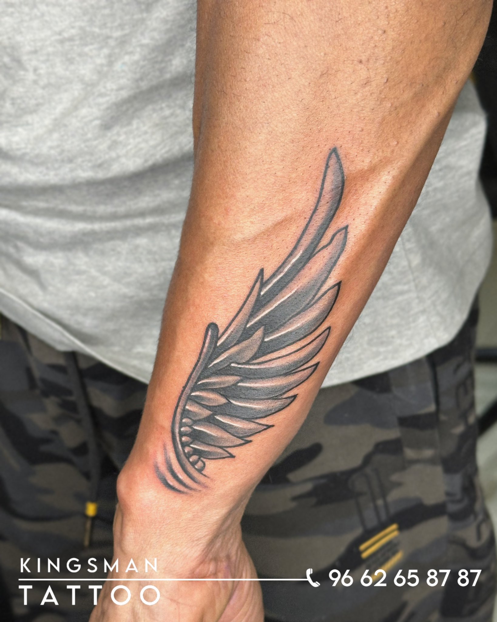 small wing tattoo on forearm 0012