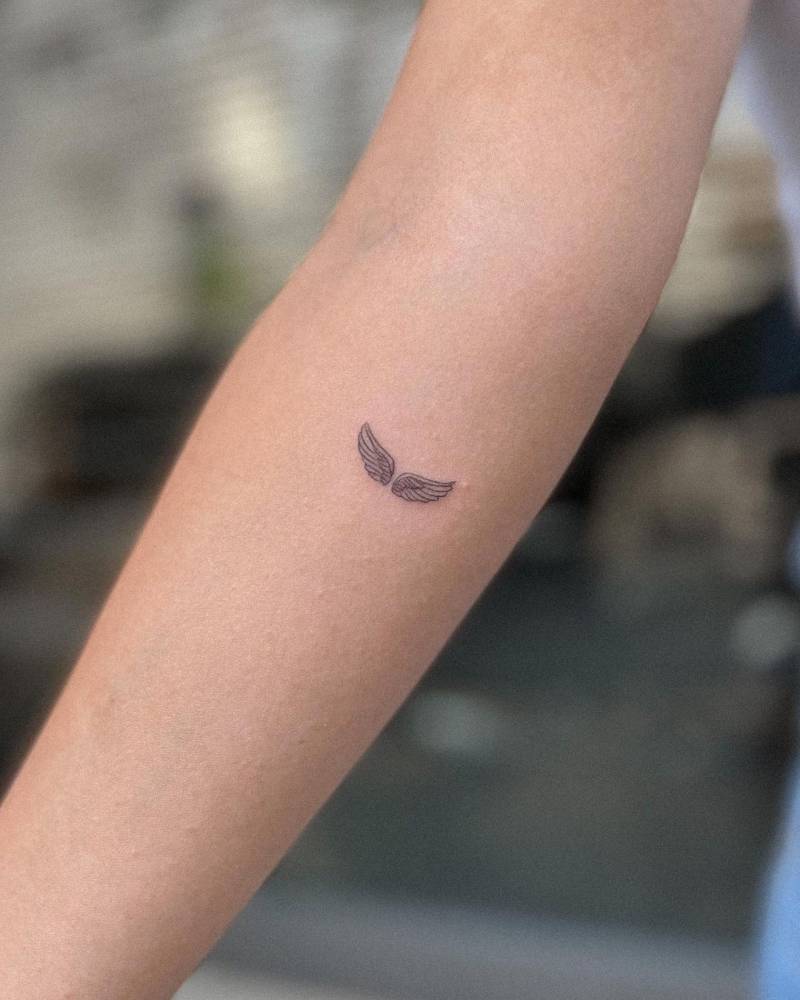 small wing tattoo on forearm 0013