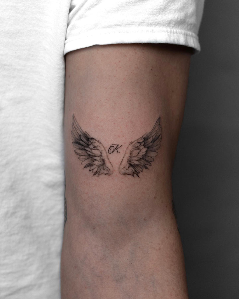 small wing tattoo on forearm 0014