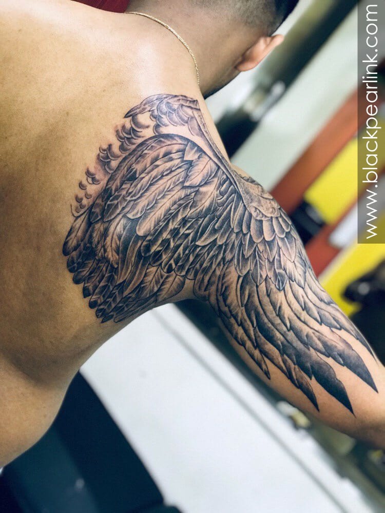 small wing tattoo on forearm 0015