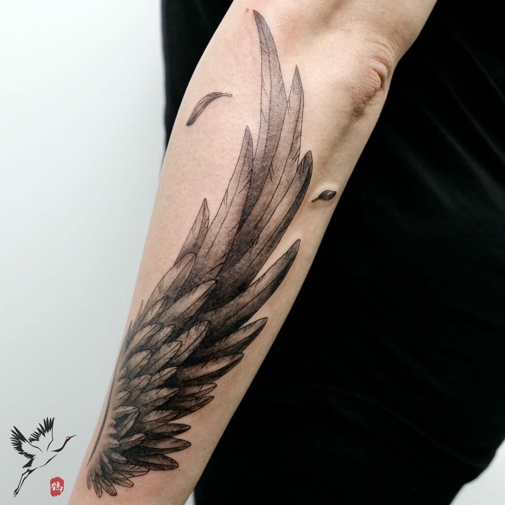 small wing tattoo on forearm 0016