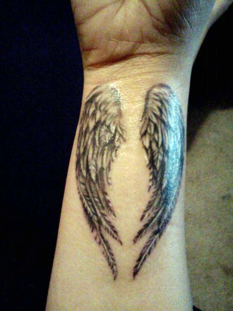 small wing tattoo on forearm 0021