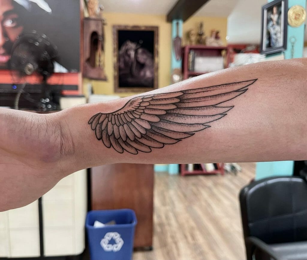 small wing tattoo on forearm 0024