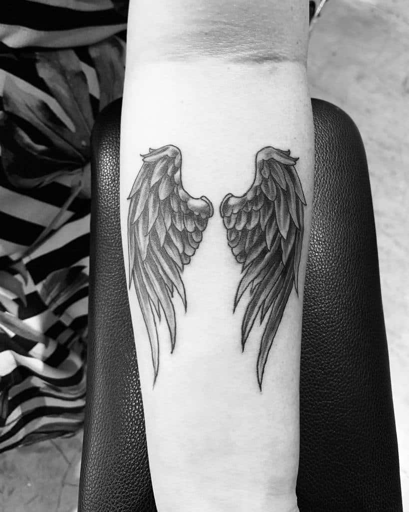 small wing tattoo on forearm 0028