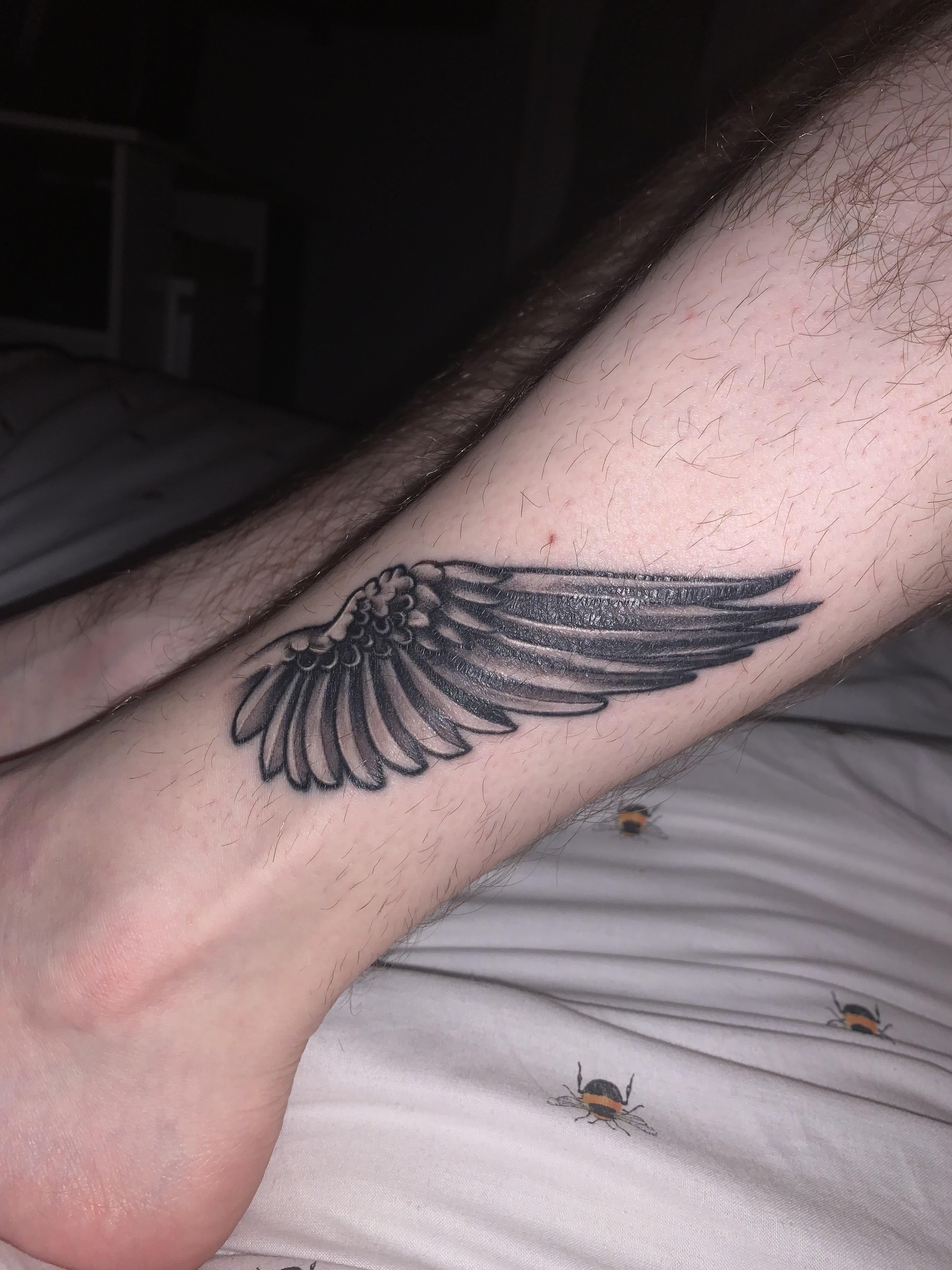 small wing tattoo on forearm 0030