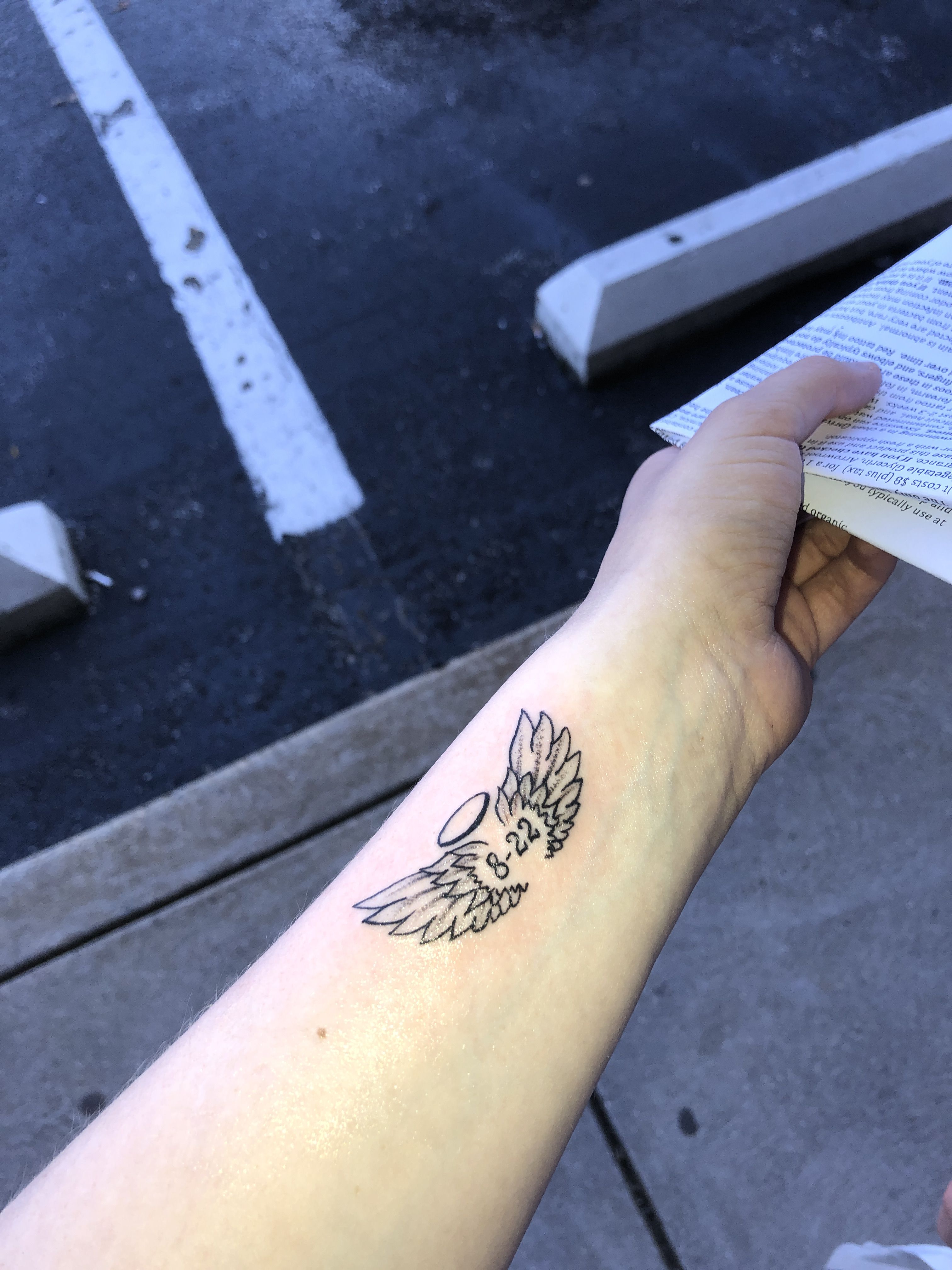 small wing tattoo on forearm 0035