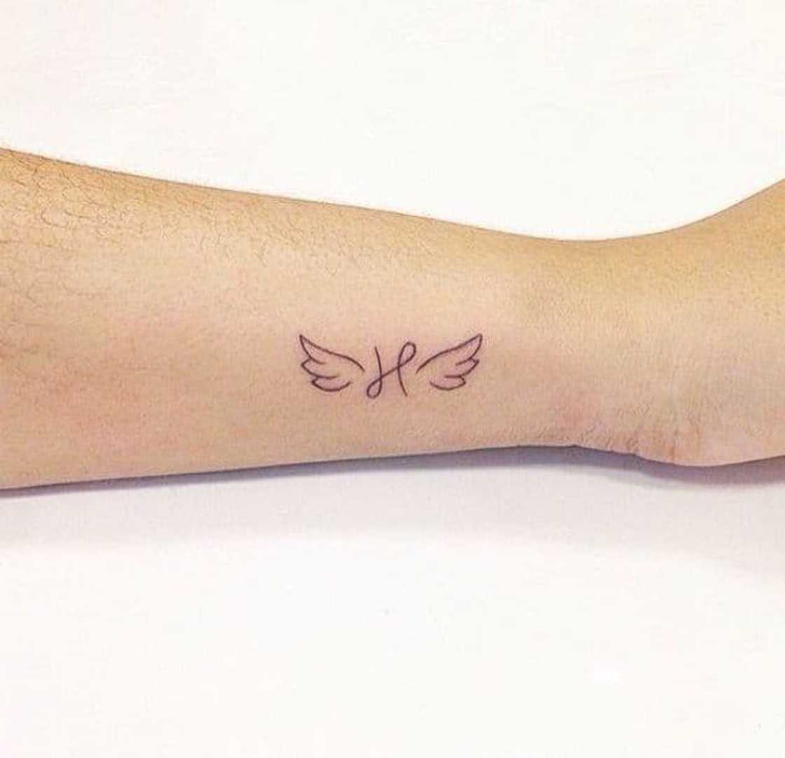 small wing tattoo on forearm 0036