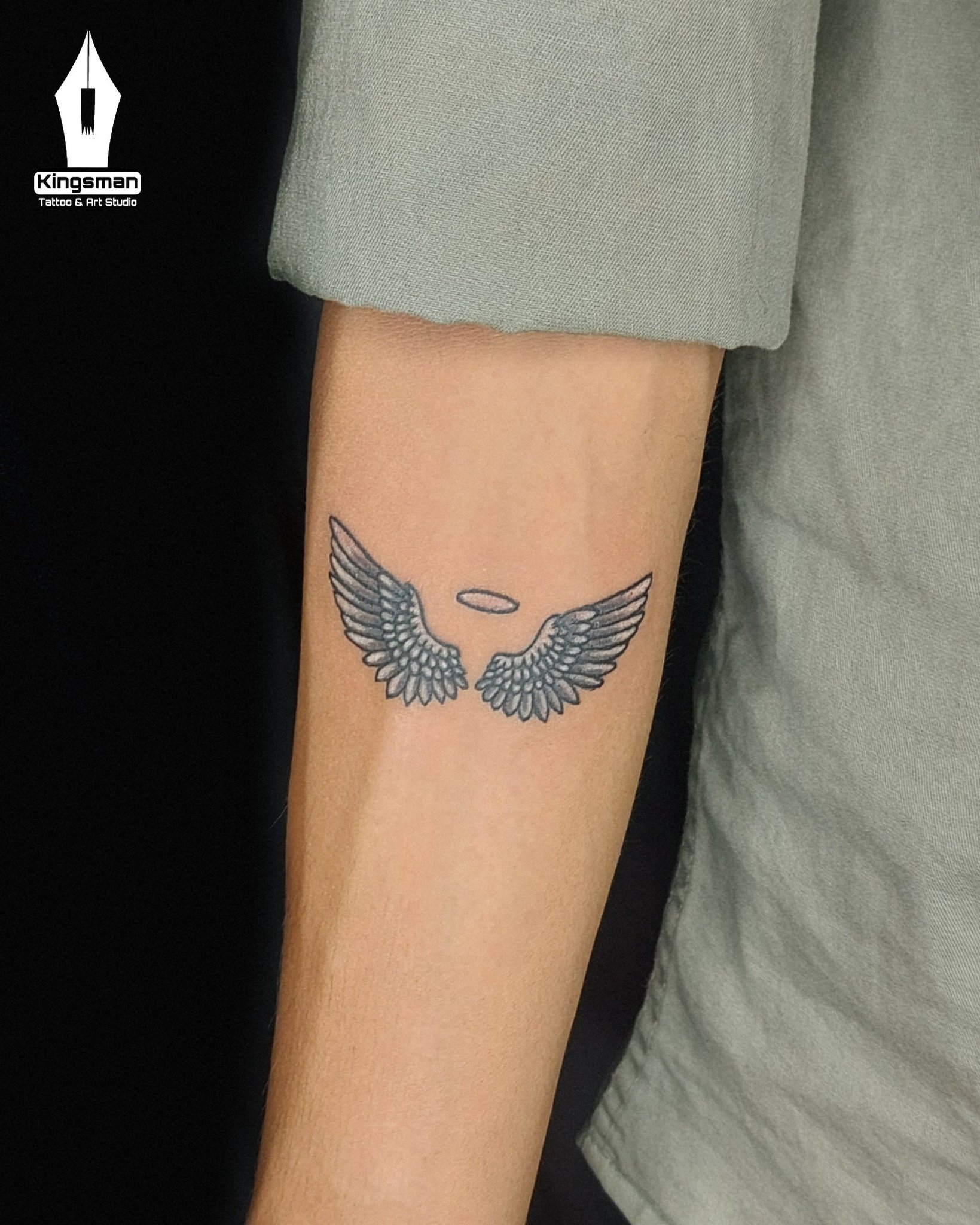 small wing tattoo on forearm 0037