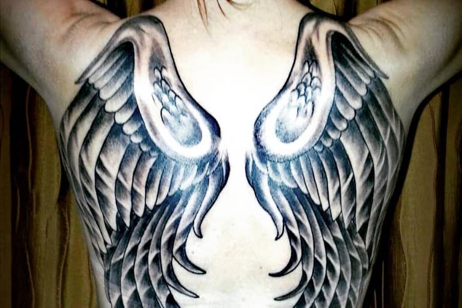 small wing tattoo on forearm 0045