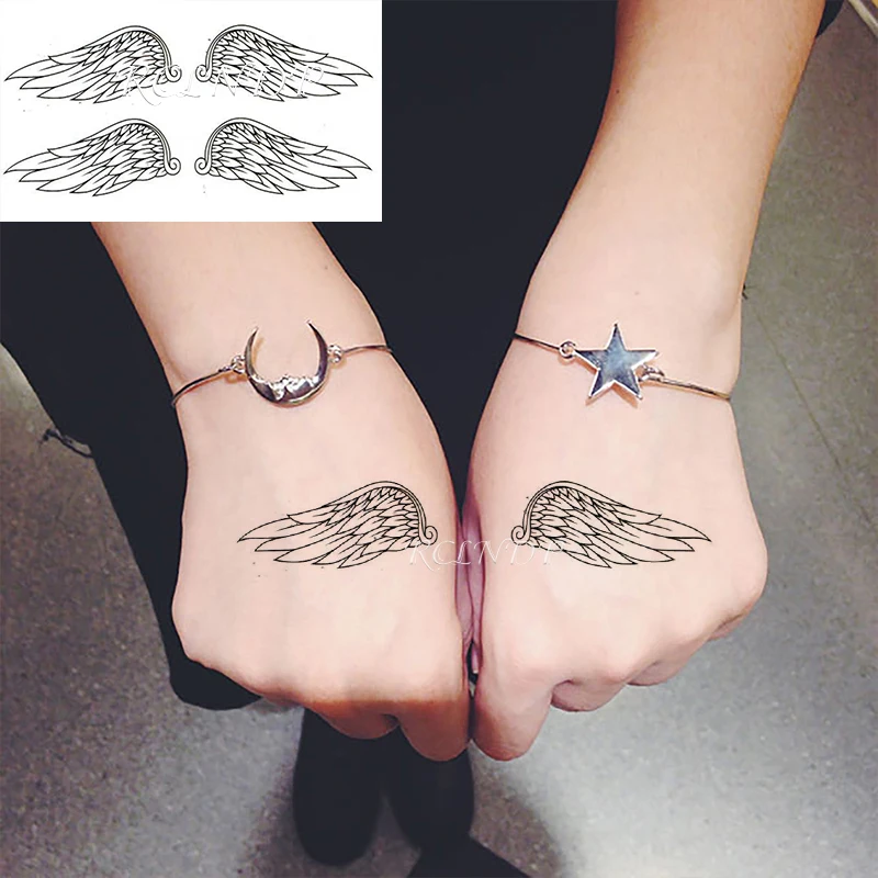 small wing tattoo on forearm 0051