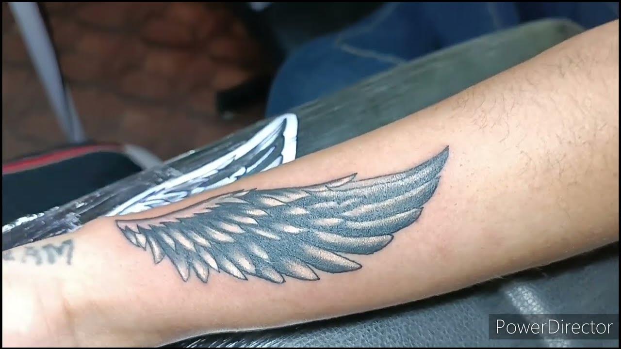 small wing tattoo on forearm 0052