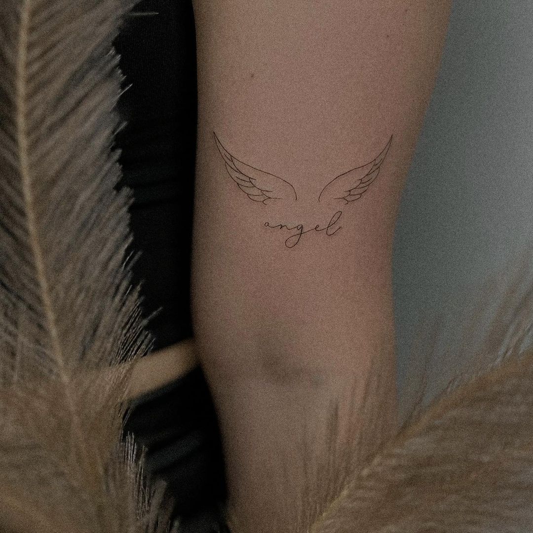 small wing tattoo on forearm 0055