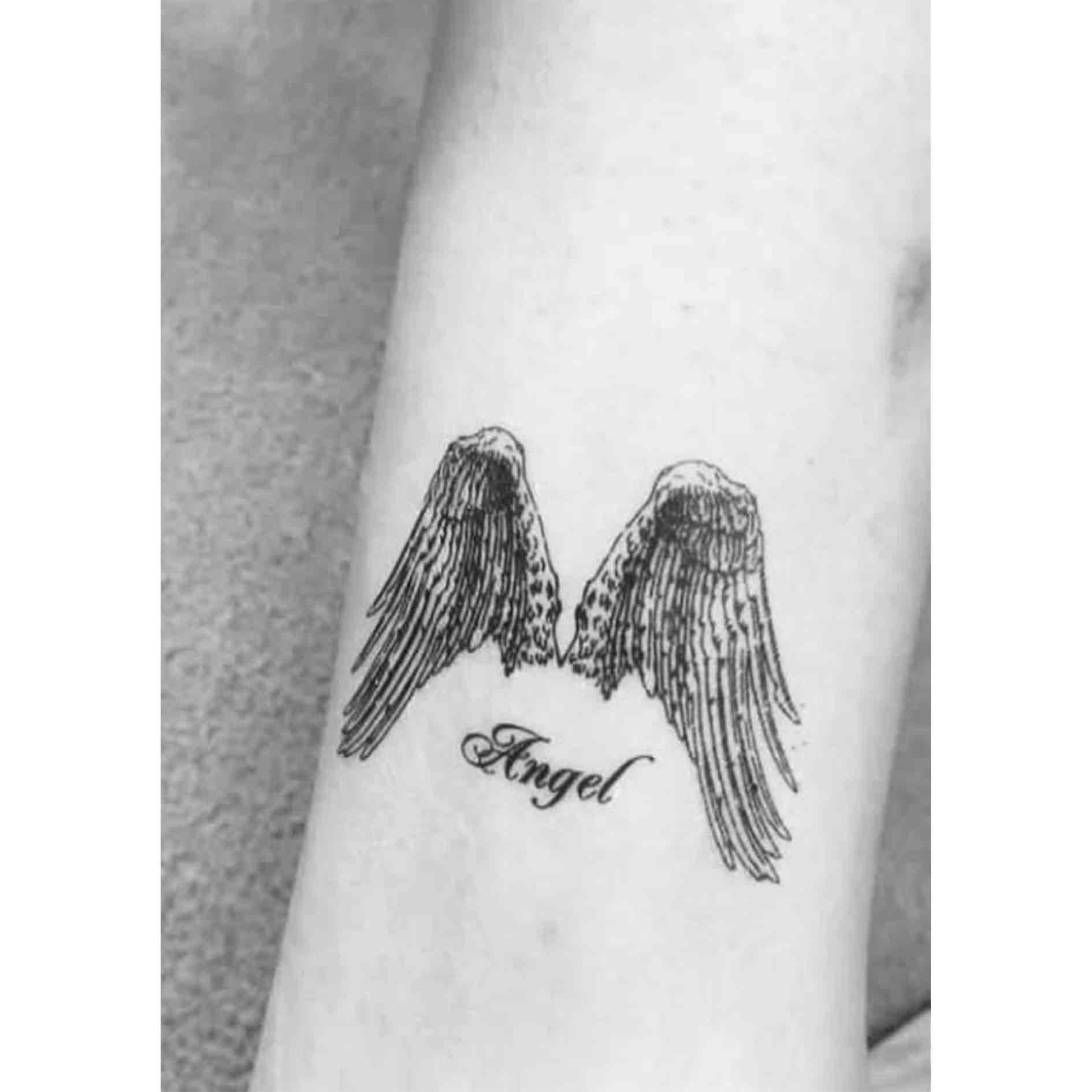 small wing tattoo on forearm 0075