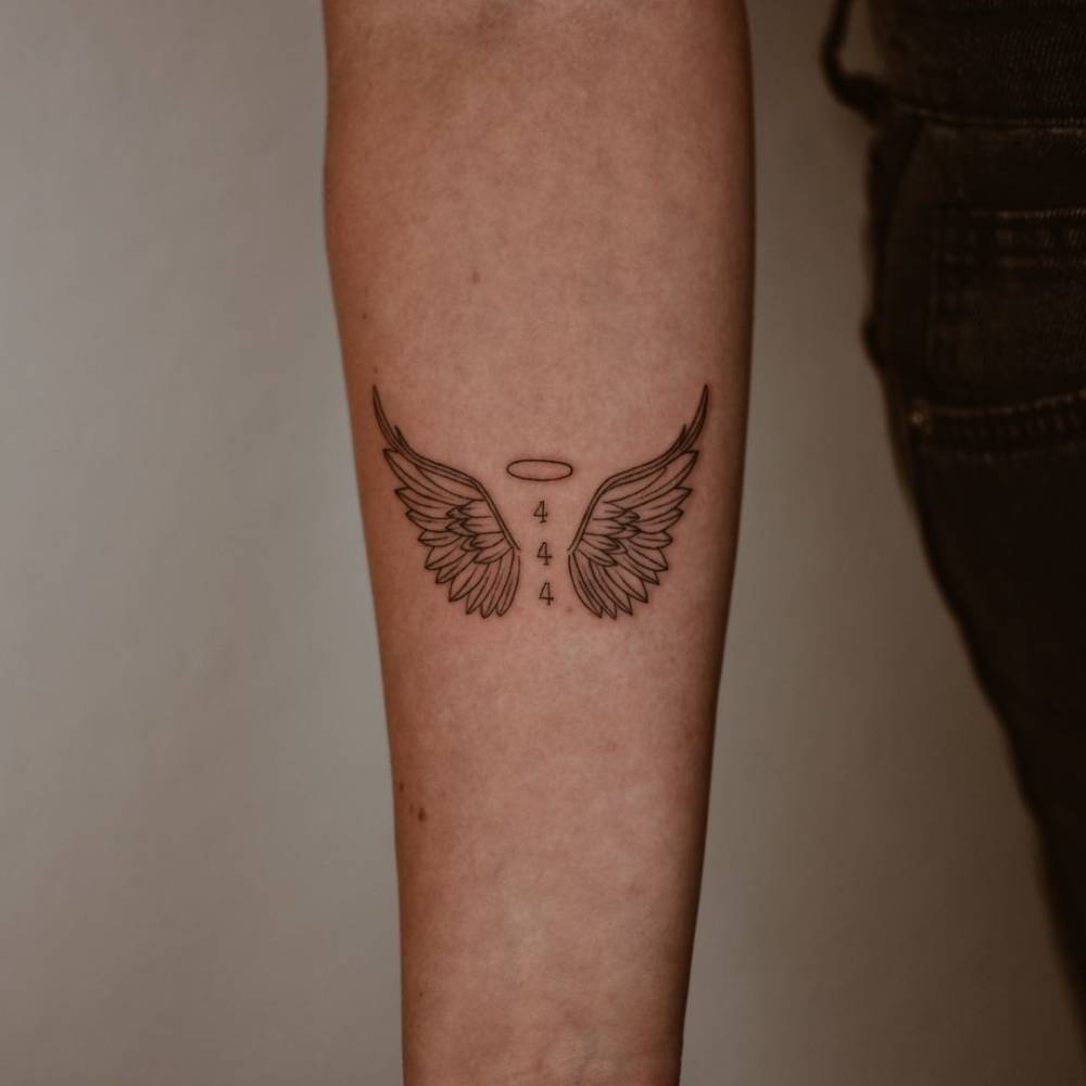 small wing tattoo on forearm 0077